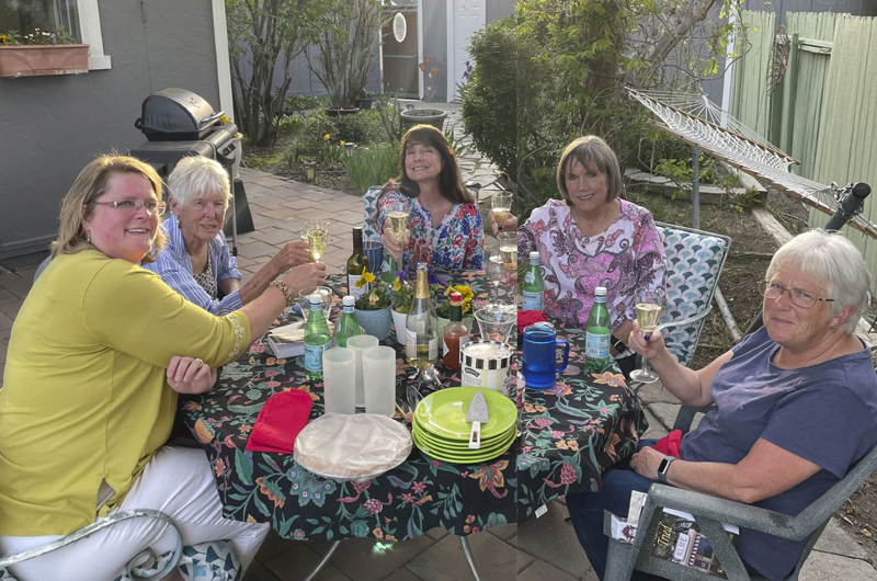 About 20 of Yvonne's friends dropped by Tuesday, May 17, to celebrate books and springtime in her botanical garden of a yard.