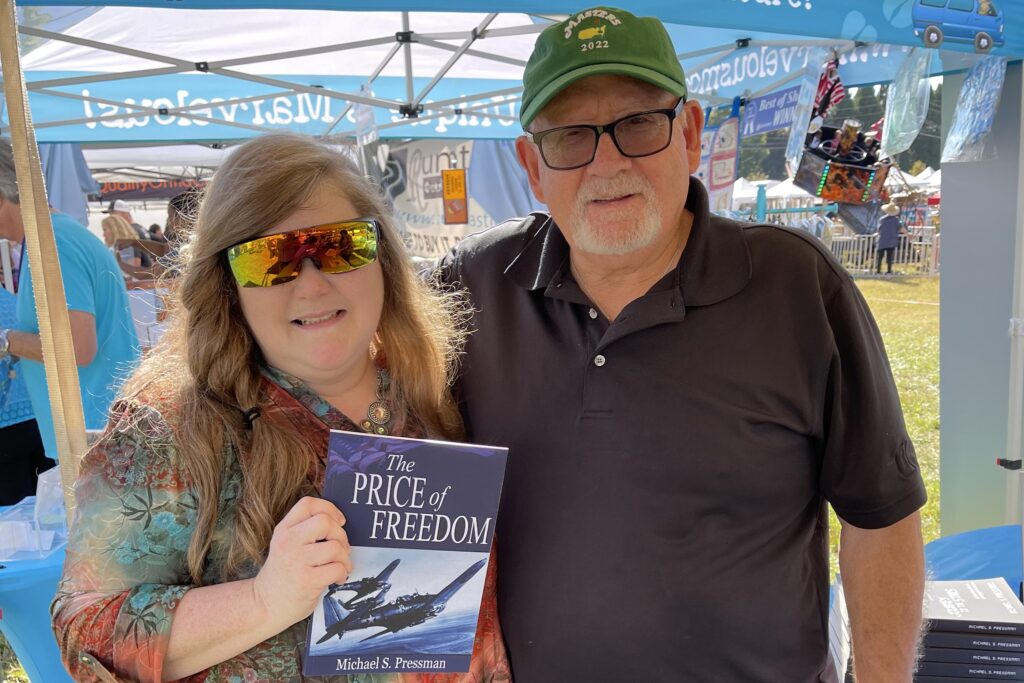 Author Michael S. Pressman sells his "The Price of Freedom."